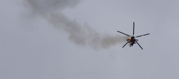 Вертолет правительственной армии Сирии, атакованный ракетой в провинции Идлиб - Sputnik Moldova
