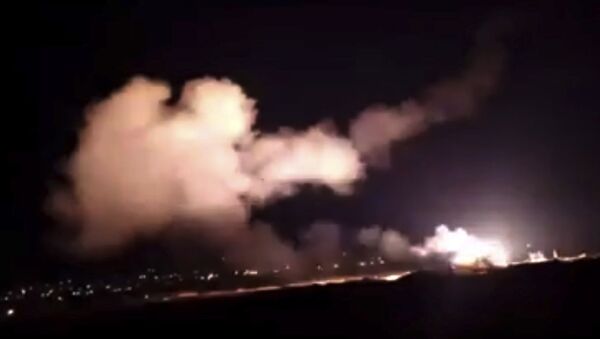 This frame grab from a video provided by the Syrian official news agency SANA shows missiles flying into the sky near Damascus, Syria, Tuesday, Dec. 25, 2018 - Sputnik Moldova-România