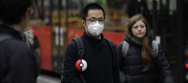 Мужчина в лицевой маске из-за распространения коронавируса - Sputnik Moldova-România