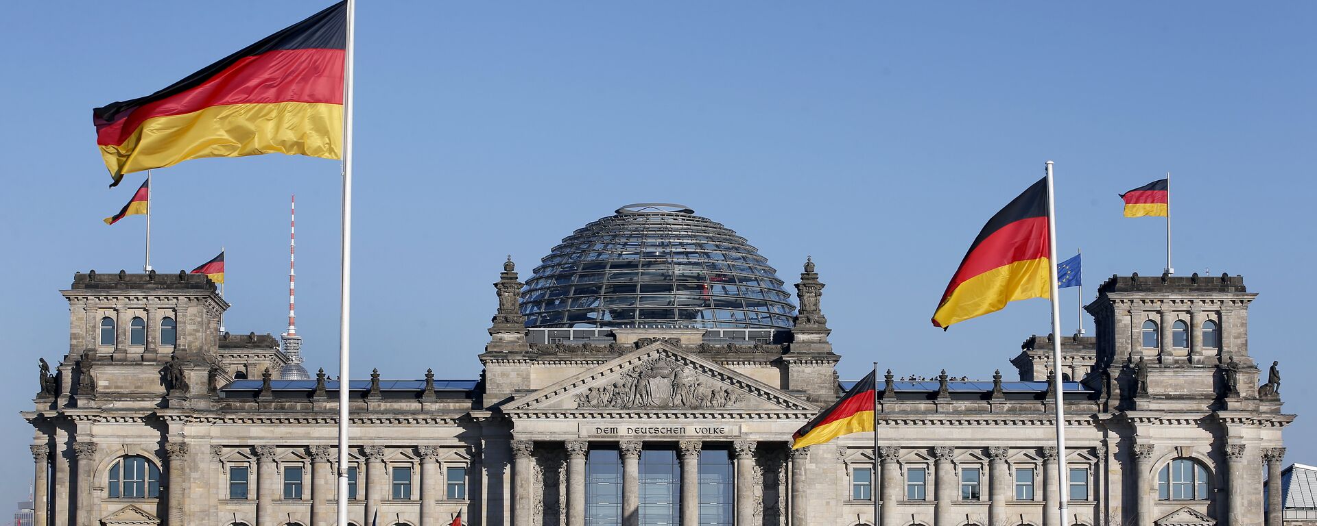 German flags wave in front of the Reichstag building, host of the German Federal Parliament Bundestag, in Berlin, Germany. (File) - Sputnik Moldova, 1920, 26.02.2021