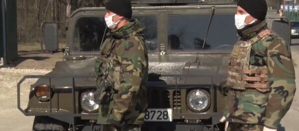 Военнослужащие национальной армии Молдовы в селе Толмаза, где введен карантин - Sputnik Moldova