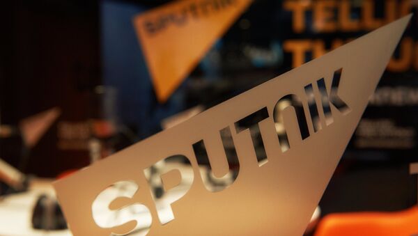 Логотип международного информационного бренда Sputnik  - Sputnik Moldova-România