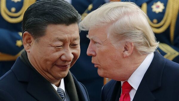 FILE - In this Nov. 9, 2017, file photo, U.S. President Donald Trump, right, chats with Chinese President Xi Jinping during a welcome ceremony at the Great Hall of the People in Beijing - Sputnik Moldova-România