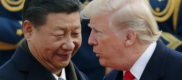 FILE - In this Nov. 9, 2017, file photo, U.S. President Donald Trump, right, chats with Chinese President Xi Jinping during a welcome ceremony at the Great Hall of the People in Beijing - Sputnik Moldova-România