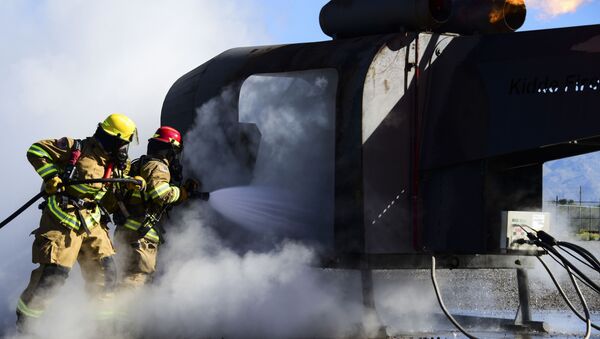 Firefighters from the 355th Civil Engineer Squadron extinguish a fire during training at Davis-Monthan Air Force Base, Ariz., April 14, 2020.  - Sputnik Moldova-România