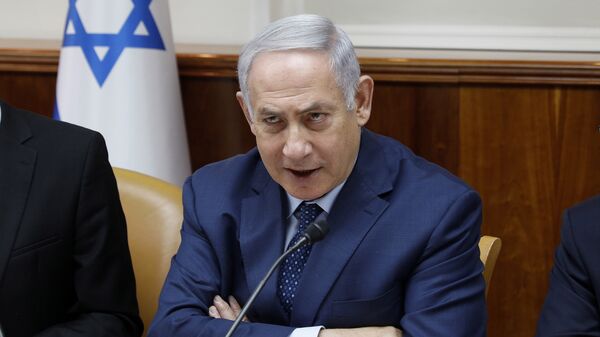Israeli Prime Minister Benjamin Netanyahu chairs the weekly cabinet meeting at the Prime Minister's office in Jerusalem, Sunday, April 15, 2018 - Sputnik Moldova-România