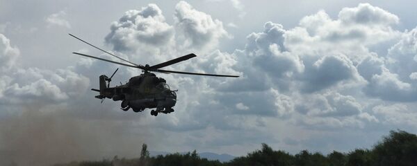 Российский ударный вертолет МИ-24 на аэродроме Хмеймим в Сирии - Sputnik Moldova-România