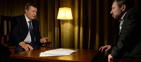 Бывший президент Украины Виктор Янукович и Захар Виноградов - Sputnik Молдова