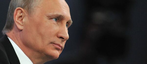 Russian President Vladimir Putin listens to a question during his annual televised phone-in with the nation in central Moscow on April 16, 2015. - Sputnik Moldova