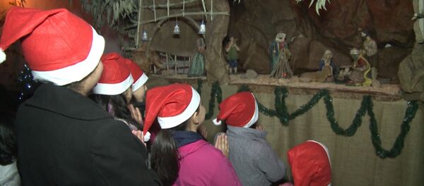 СПУТНИК_Молитва у вертепа и фото с Сантой – сирийские христиане отметили Рождество - Sputnik Молдова