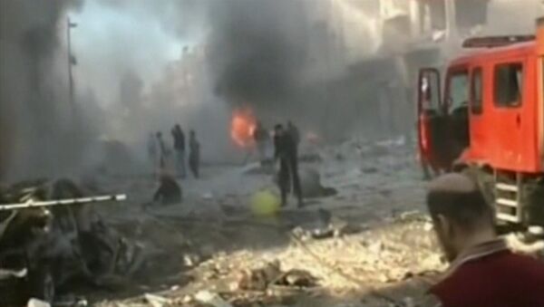 СПУТНИК_Взрыв и пожар на улицах Хомса – последствия тройного теракта в Сирии - Sputnik Молдова