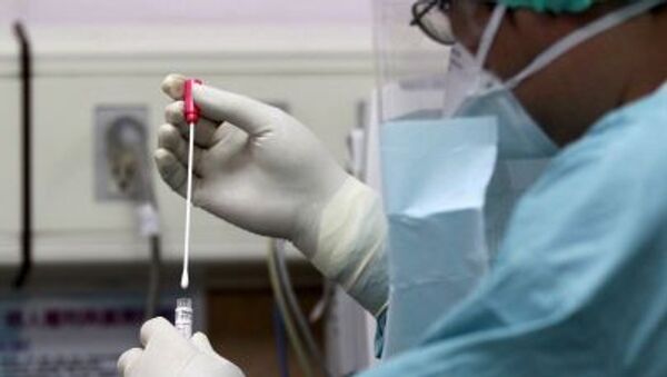 Медицинский работник принимает участие в приготовлении в случае вспышки вируса MERS в Тайбэе, Тайвань - Sputnik Молдова