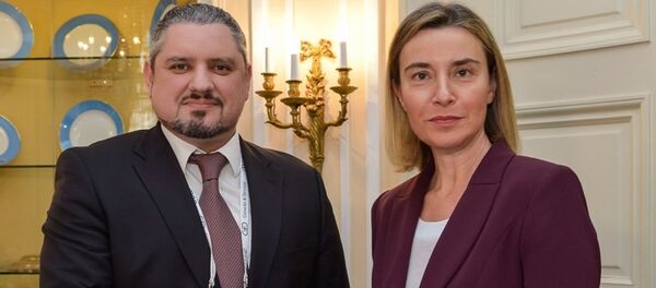 Andrei Galbur şi Federica Mogherini, la München - Sputnik Moldova