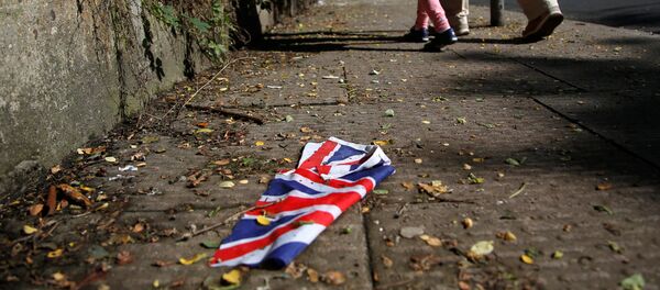 A British flag which was washed away by heavy rains the day before lies on the street in London, Britain, June 24, 2016 after Britain voted to leave the European Union in the EU BREXIT referendum. - Sputnik Moldova