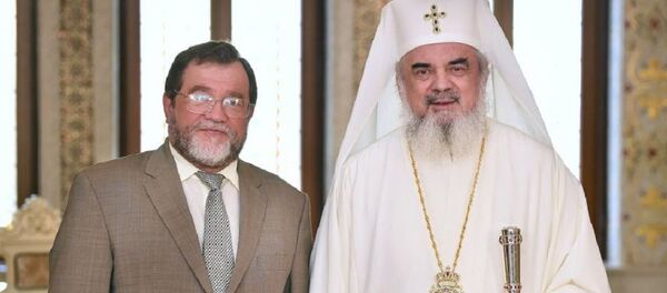 Oleg Malghinov și Preafericitul Daniel - Sputnik Moldova-România