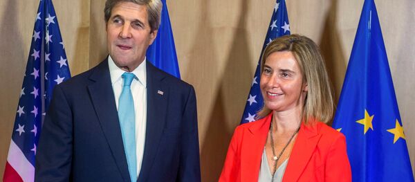 U.S. Secretary of State John Kerry poses with EU foreign policy chief Federica Mogherini (R) during an European Union foreign ministers meeting in Brussels, Belgium, July 18, 2016. - Sputnik Moldova