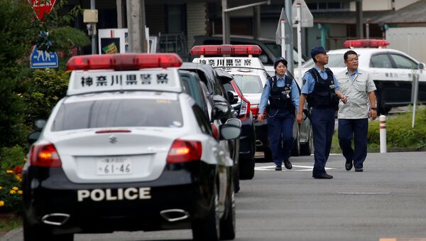 Police officers investigate near a facility for the disabled, where a deadly attack by a knife-wielding man took place, in Sagamihara, Kanagawa prefecture, Japan, July 26, 2016. - Sputnik Moldova-România