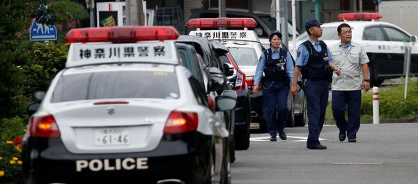 Police officers investigate near a facility for the disabled, where a deadly attack by a knife-wielding man took place, in Sagamihara, Kanagawa prefecture, Japan, July 26, 2016. - Sputnik Молдова