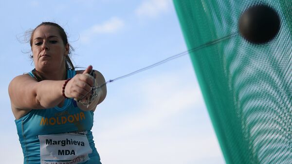 Залина Маргиева в финальных соревнованиях по легкой атлетике в метании молота среди женщин - Sputnik Молдова
