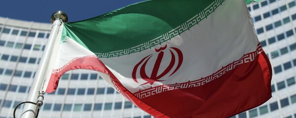 The Iranian flag flies in front of a UN building where closed-door nuclear talks take place at the International Center in Vienna, Austria, Friday, July 4, 2014. - Sputnik Молдова