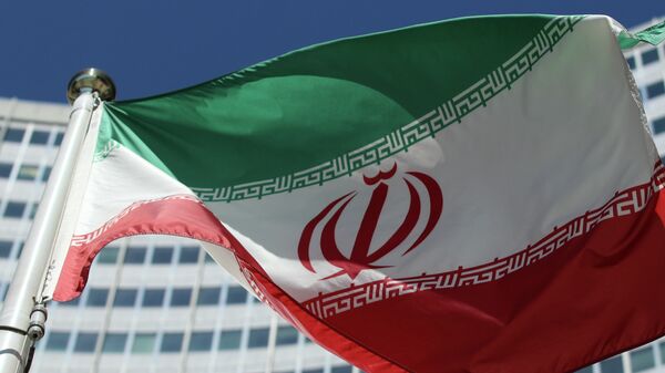 The Iranian flag flies in front of a UN building where closed-door nuclear talks take place at the International Center in Vienna, Austria, Friday, July 4, 2014. - Sputnik Moldova-România