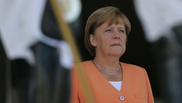 German Chancellor Angela Merkel stands during the playing of Germany's national anthem during a welcome ceremony at the Planalto Presidential Palace, in Brasilia, Brazil, Thursday, Aug. 20, 2015 - Sputnik Moldova-România