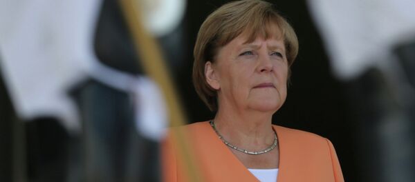 German Chancellor Angela Merkel stands during the playing of Germany's national anthem during a welcome ceremony at the Planalto Presidential Palace, in Brasilia, Brazil, Thursday, Aug. 20, 2015 - Sputnik Moldova-România