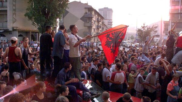 About 1,000 young Kosovar Albanians celebrate the UCK [Kosovo Liberation Army] victory over the Serbs with NATO's help in the centre of Pristina 02 July 1999 - Sputnik Moldova