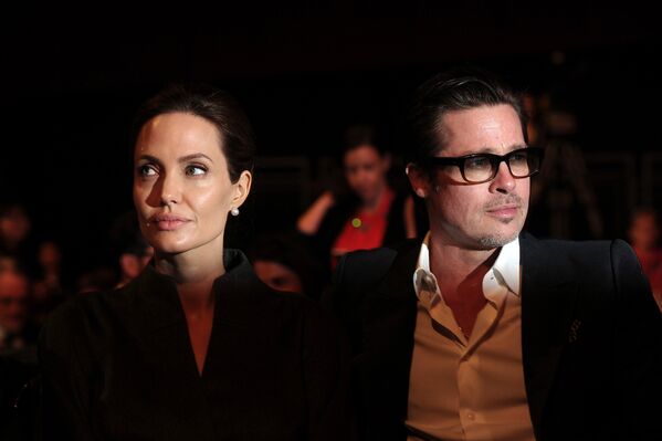 Angelina Jolie și Brad Pitt la summitul global pentru eradicarea violenței sexuale, Londra, 13 iunie 2014. - Sputnik Moldova
