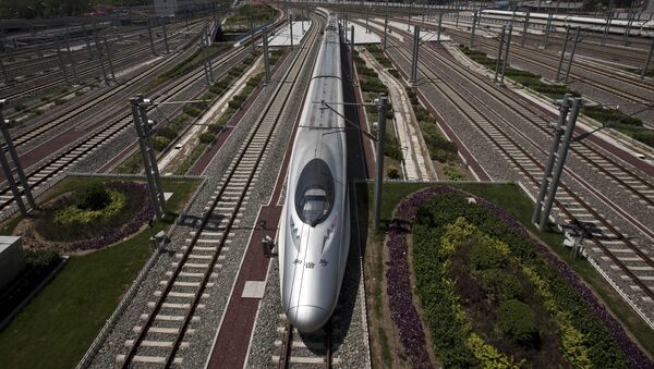 A CRH high-speed train leaves the Beijing South Station in Beijing, China, Tuesday, July 26, 2011 - Sputnik Moldova-România