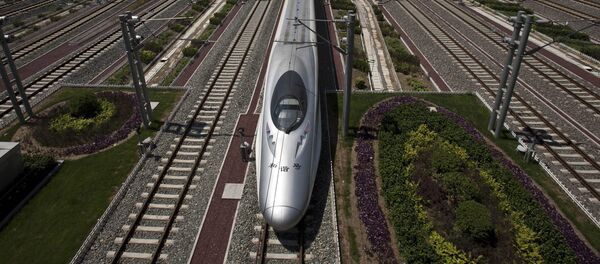 A CRH high-speed train leaves the Beijing South Station in Beijing, China, Tuesday, July 26, 2011 - Sputnik Moldova-România