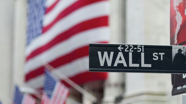 A Wall Street sign hangs near the New York Stock Exchange. - Sputnik Moldova