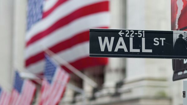A Wall Street sign hangs near the New York Stock Exchange. - Sputnik Moldova-România
