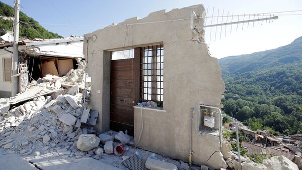 A front door of a collapsed house is seen following an earthquake in Pescara del Tronto, central Italy, August 26, 2016 - Sputnik Moldova