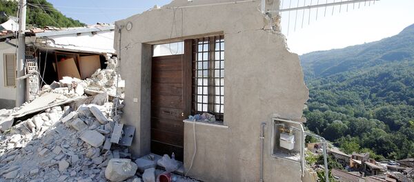 A front door of a collapsed house is seen following an earthquake in Pescara del Tronto, central Italy, August 26, 2016 - Sputnik Moldova